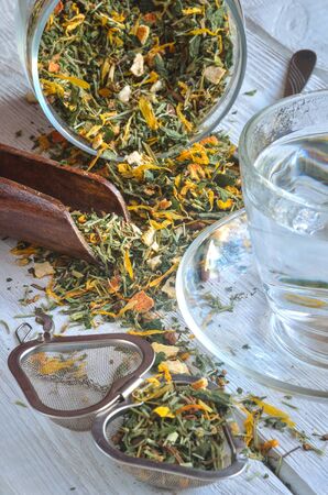 Interesting drink concept. Tea for a healthy complexion on a wooden table.の写真素材