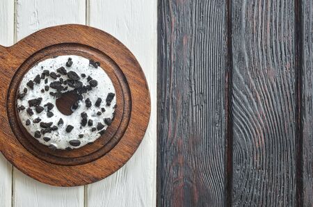 Sweet tasty dessert. Donut with a hole on wooden dishes.の写真素材