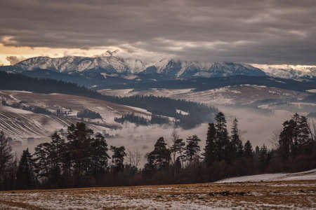 Beautiful winter landscape. A rural valley between the hills.の写真素材