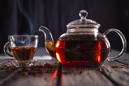 Hot healthy infusion. Tea brewed in a glass kettle.の写真素材