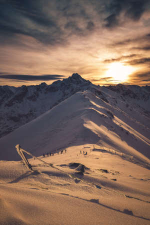 Beautiful winter landscape. Morning on the snow capped peaks of the mountains.の写真素材