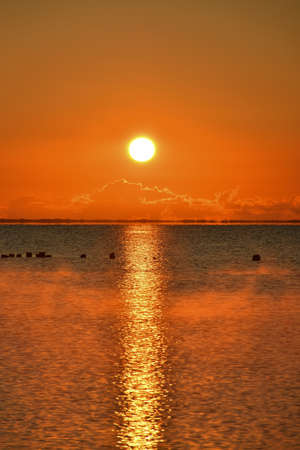 Beautiful orange seaside landscape. Sunset at the Polish seaside in Gydnia.の写真素材
