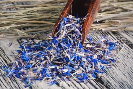 Herbs and a healthy lifestyle. Cornflower on a wooden table.の写真素材