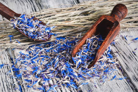 Herbs and a healthy lifestyle. Cornflower on a wooden table.の写真素材