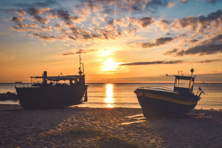 Beautiful morning view at the Polish seaside in Gdynia. Ships on a sandy beach in the morning.の写真素材