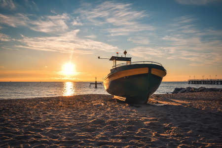 Beautiful morning view at the Polish seaside in Gdynia. Ship on a sandy beach in the morning.の写真素材