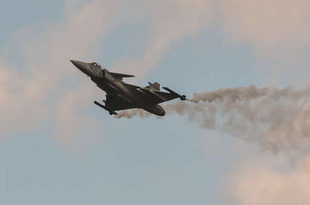 Gdynia; Poland - August 21; 2021: Flight of the Swedish JAS 39 Gripen fighter plane at the Aero Baltic show in Gdynia; Poland.のeditorial素材