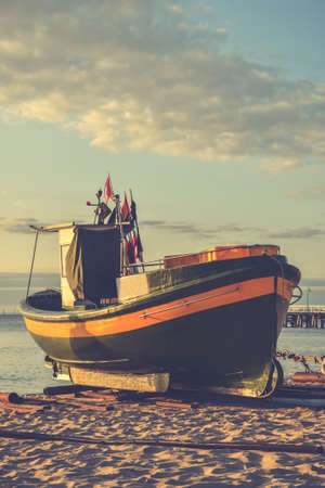 Beautiful morning view at the Polish seaside in Gdynia. Ship on a sandy beach in the morning.の写真素材