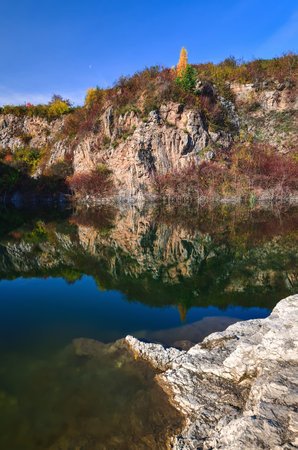 Natural conceptual autumn idea. Quarry landscape with leaves in fall colors. Photo taken in Kielce, Poland.の写真素材