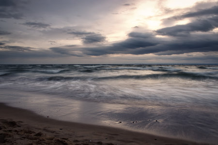 Winter sea landscape. Empty wavy sea on a cloudy day.の写真素材