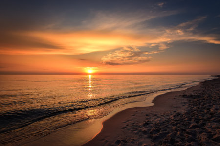 Beautiful summer holiday landscape. Sunset over the Polish sea in Leba.の写真素材