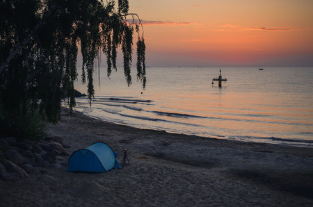Beautiful morning seaside landscape. Tent on the beach in Gdynia, Poland.の写真素材