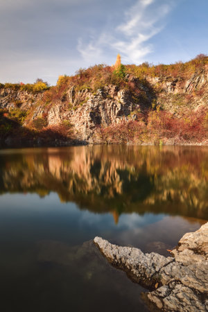 Natural conceptual autumn idea. Quarry landscape with leaves in fall colors. Photo taken in Kielce, Poland.の写真素材