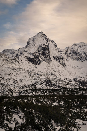 Winter mountain landscape in Polish Tatra Mountains. Snowy morning with a view of the Koscielec mountain in the Tatra National Park.の写真素材