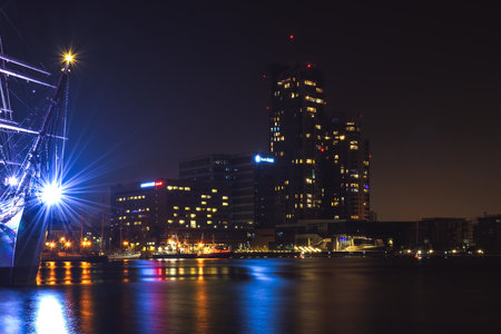 Gdynia, Poland - February 15, 2020: Night view of a modern skyscraper and port in Gdynia, Poland.のeditorial素材