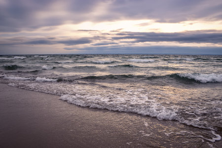 Cloudy winter seaside landscape. Cloudy day on the beach in Gdynia, Poland.の写真素材