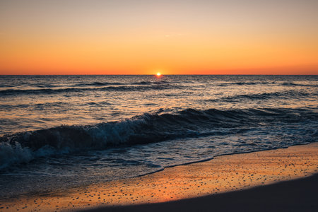 Beautiful colorful landscape on the beach by the sea. Sunrise over the Baltic Sea in Jastarnia, Poland.の写真素材