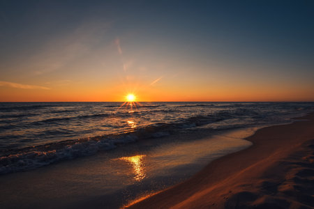 Beautiful colorful landscape on the beach by the sea. Sunrise over the Baltic Sea in Jastarnia, Poland.の写真素材