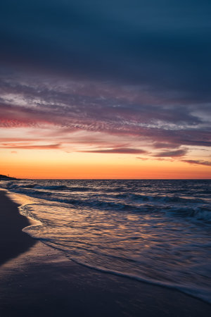 Beautiful colorful landscape on the beach by the sea. Sunrise over the Baltic Sea in Jastarnia, Poland.の写真素材