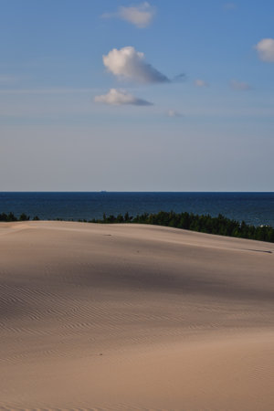 Beautiful holiday seaside landscape. Moving dunes in the desert in Slowinski National Park in Leba, Poland.の写真素材