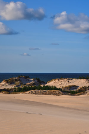 Beautiful holiday seaside landscape. Moving dunes in the desert in Slowinski National Park in Leba, Poland.の写真素材