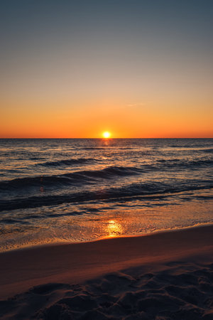 Beautiful colorful landscape on the beach by the sea. Sunrise over the Baltic Sea in Jastarnia, Poland.の写真素材