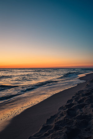 Beautiful colorful landscape on the beach by the sea. Sunrise over the Baltic Sea in Jastarnia, Poland.の写真素材