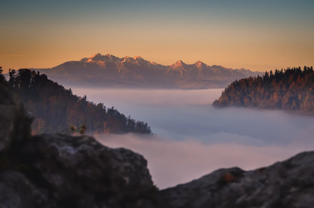 Fabulous colorful autumn landscape. Magical morning in the Polish mountains. Photo taken on top of Sokolica in Pieniny, Poland.の写真素材