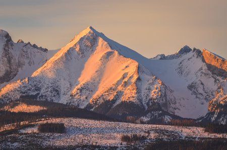 Charming panorama of the Polish Tatra Mountains in the morning. View of the Belianske Tatras from the village of Lapszanka, Poland.の写真素材