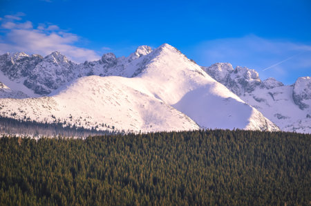 Beautiful early spring mountain landscape. View of the snow-white peaks in the Polish Tatra Mountains.の写真素材