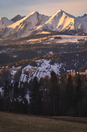 Charming panorama of the Polish Tatra Mountains in the morning. View of the Belianske Tatras from the village of Lapszanka, Poland.の写真素材