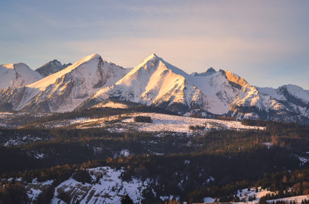 Charming panorama of the Polish Tatra Mountains in the morning. View of the Belianske Tatras from the village of Lapszanka, Poland.の写真素材