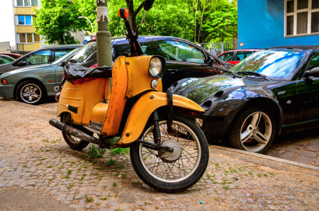 Berlin, Germany - April 30, 2014: Old motorcycle. Vintage orange motorcycle on parking area in Berlin, Germany.のeditorial素材