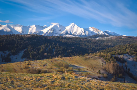 Beautiful morning spring landscape in the countryside. View of the Belianske Tatras from the village of Osturna in Slovakia.の写真素材