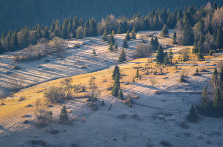 Nice morning spring landscape in the countryside. View of the hills in the village of Osturna in Slovakia illuminated by the morning sun.の写真素材