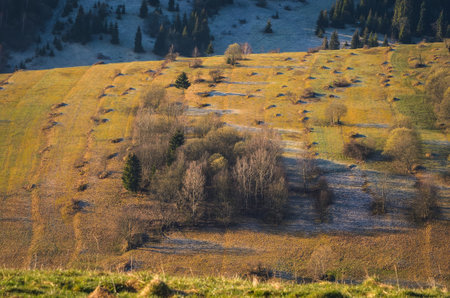 Nice morning spring landscape in the countryside. View of the hills in the village of Osturna in Slovakia illuminated by the morning sun.の写真素材