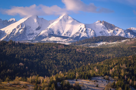 Beautiful morning spring landscape in the countryside. View of the Belianske Tatras from the village of Osturna in Slovakia.の写真素材