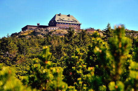 Mountain chalet at the top of Szrenica peak among dwarf mountain pines in the Karkonosze National Park in Poland.の写真素材
