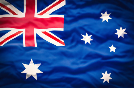 Australia flag on a wavy fabric background. Wavy flag of Australia fills the frame.の写真素材
