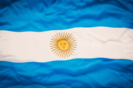 Argentina flag on a fabric wavy background. Wavy flag of Argentina fills the frame.の写真素材