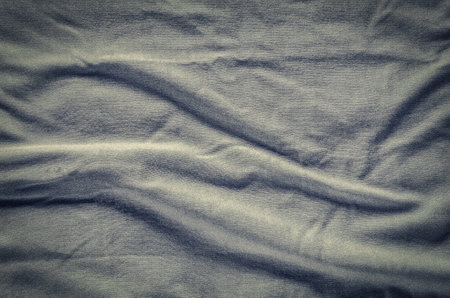 Gray wrinkled fabric texture. Close-up of soft cotton cloth, may be used as background.の写真素材
