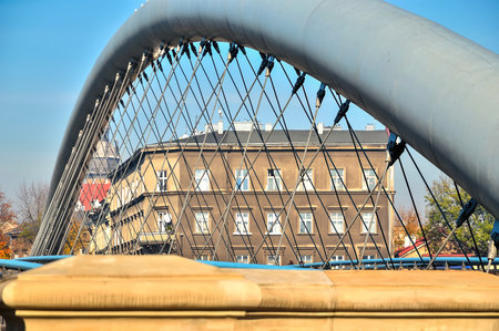 Close-up on pedestrian bridge. Footbridge above Wisla river between Kazimierz and Podgorze quarters, Krakow, Poland.の写真素材