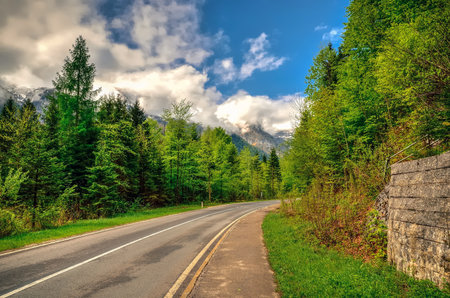 Road in Austrian mountains. Curved mountain road in Obertraun in Salzkammergut region, Austrian Alps.の写真素材