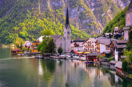 Hallstatt, Austria - May 3, 2013: Hallstatt village in Alps, Austria. Hallstatt is historical village located in Austrian Alps at the Hallstatter lake and promoted by UNESCO World Heritage region.のeditorial素材