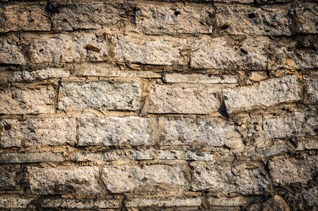 Old stone and brick texture. Wall background in vintage style.の写真素材