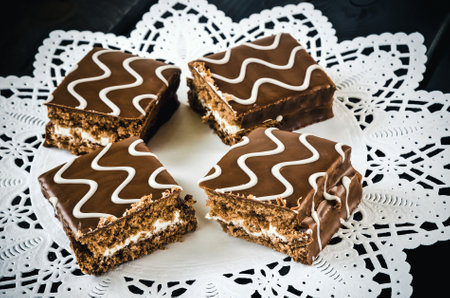 Table setting with cookies with chocolate. Chocolate coated biscuits on a white napkin.の写真素材