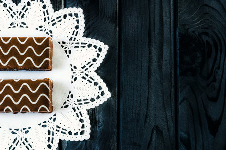 Table setting with cookies with chocolate. Chocolate coated biscuits on a white napkin.の写真素材