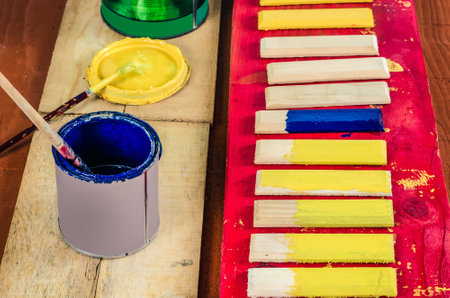 Brushes , paint and wooden boards . Painting the boards with colored paints.の写真素材