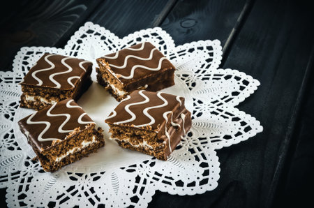 Table setting with cookies with chocolate. Chocolate coated biscuits on a white napkin.の写真素材