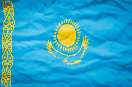 Kazakhstan flag on a wavy background. Wavy flag of Kazakhstan fills the frame.の写真素材